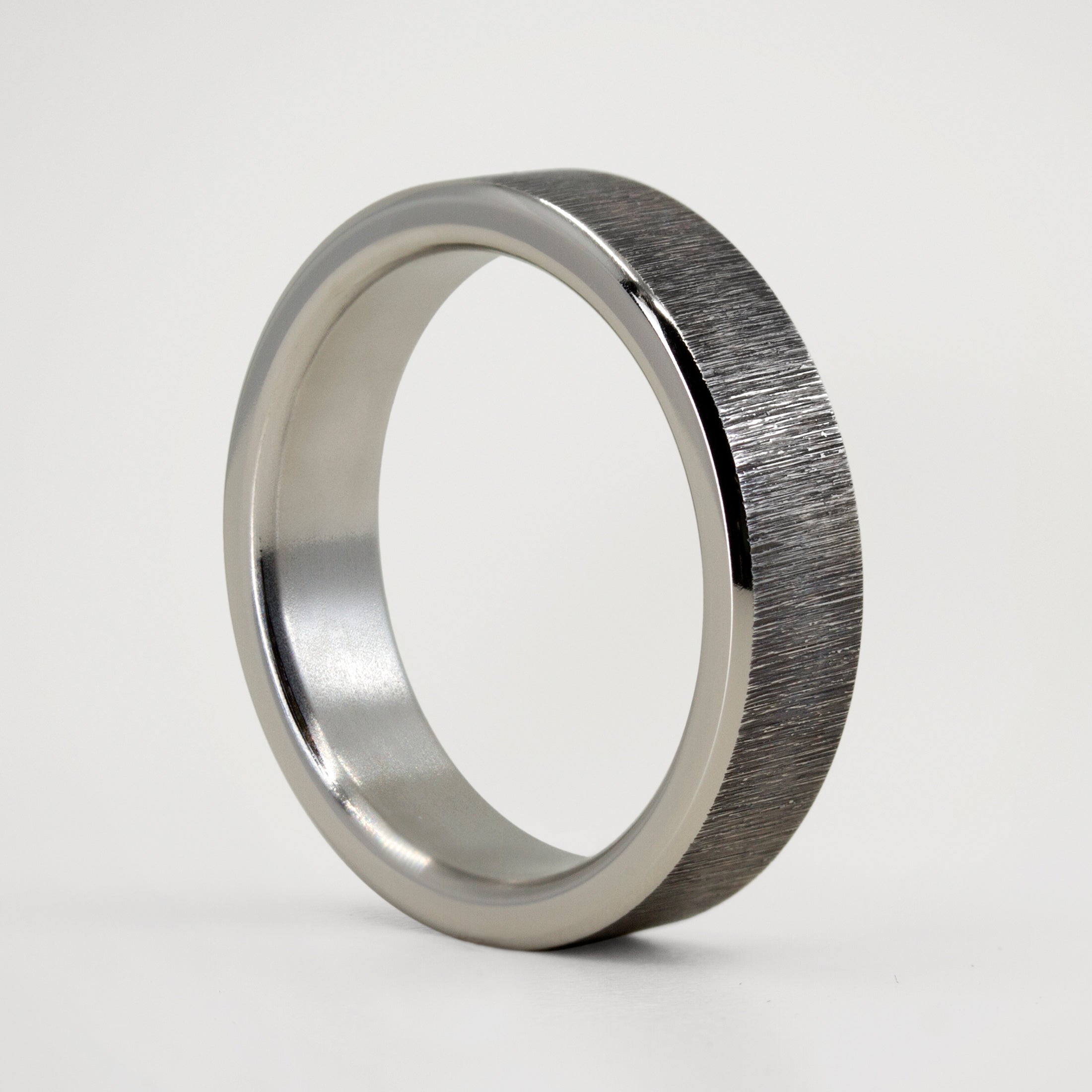 Darkened titanium ring